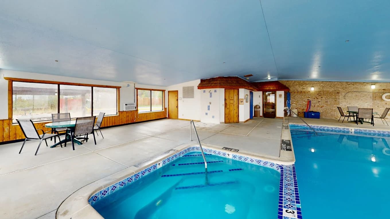 Indoor pool and hot tub at Oscoda Lakeside Hotel